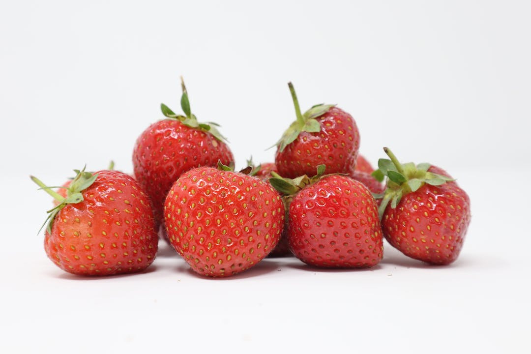 strawberries fruits on whites background
